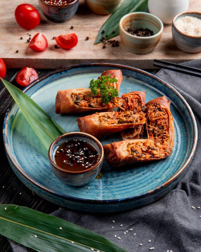 Delicious fried spring rolls with chicken, vegetables, and soy sauce